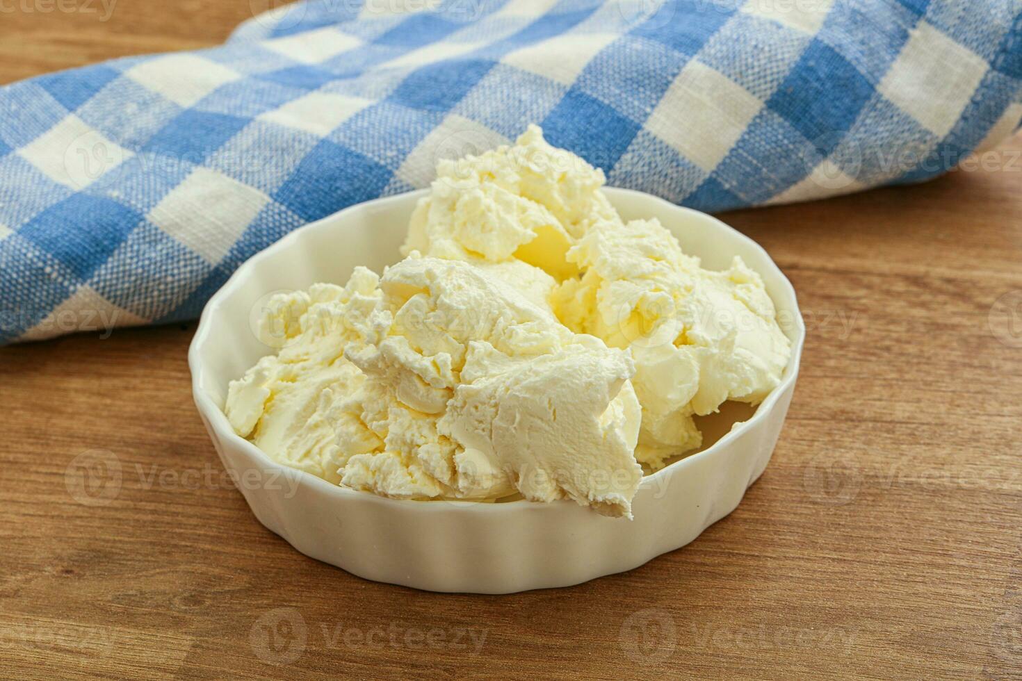 Italian soft mascarpone cheese in the bowl photo