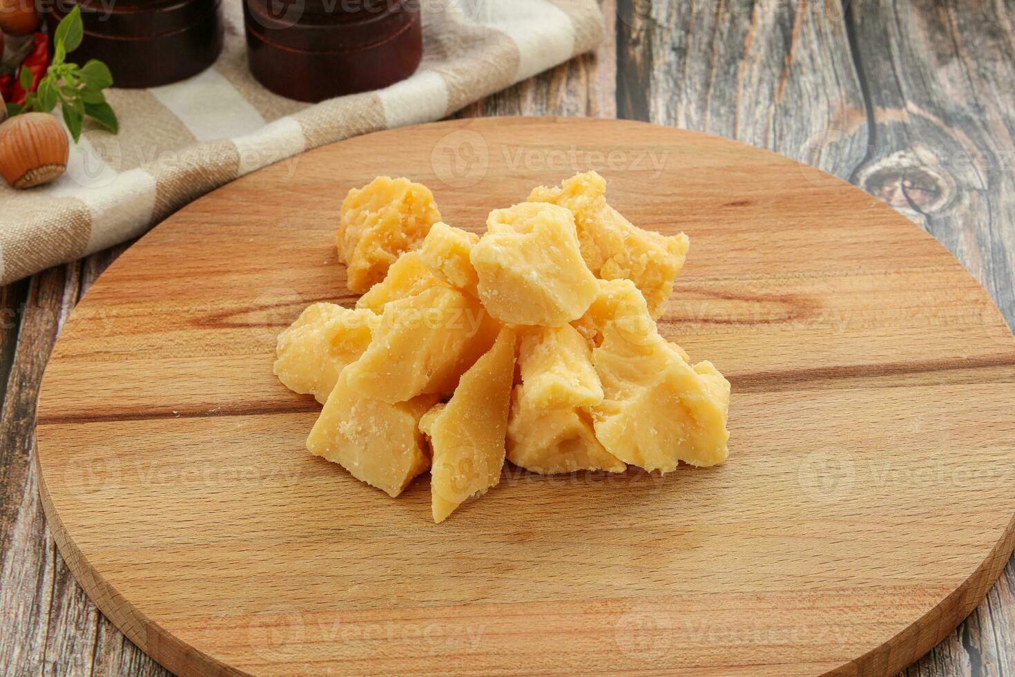 Crushed hard parmesan cheese pieces photo