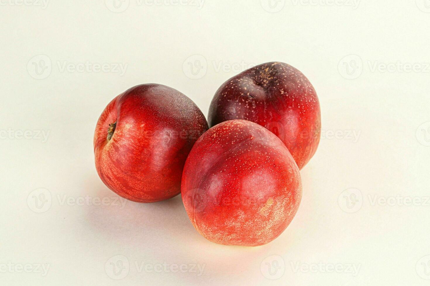 Ripe sweet juicy nectarines heap photo