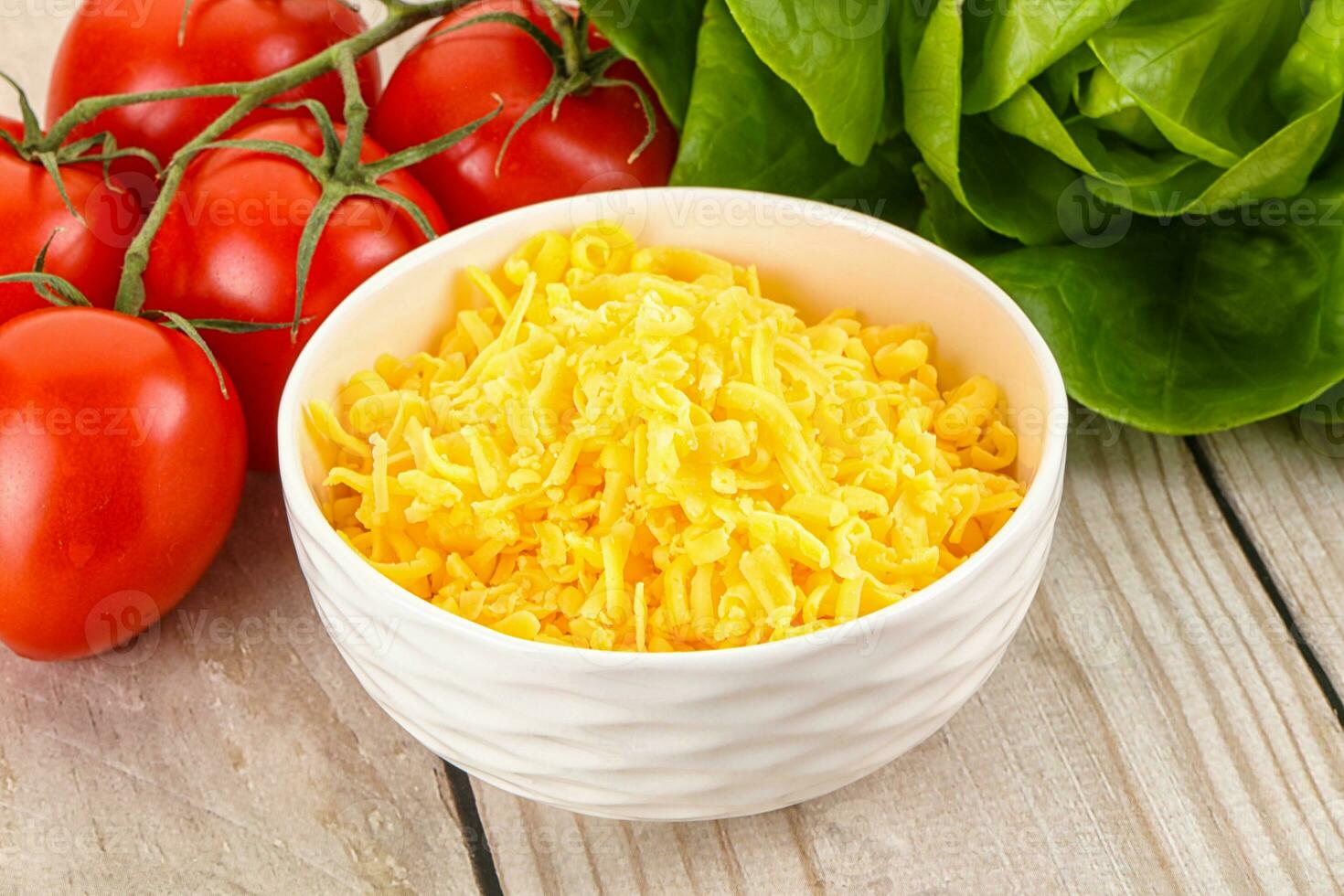 Shredded cheese in the bowl photo