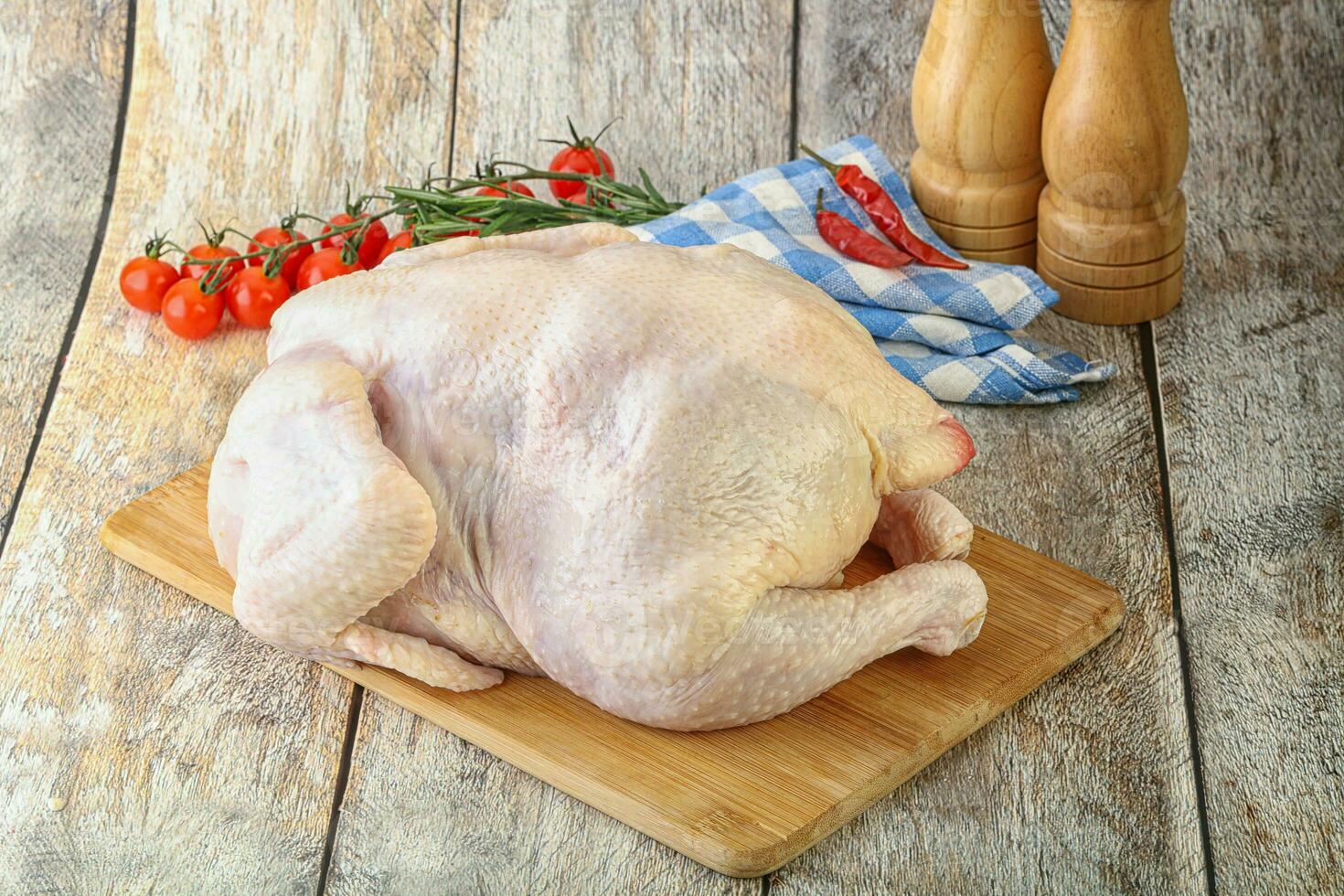 Whole raw chicken for cooking photo