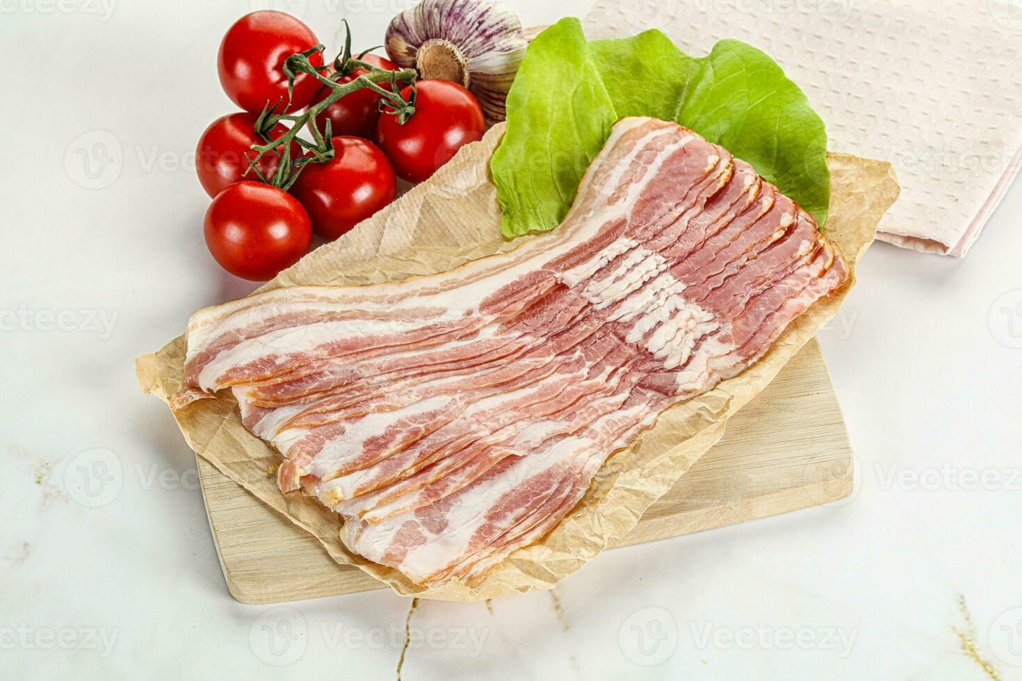 Sliced pork bacon oved board photo