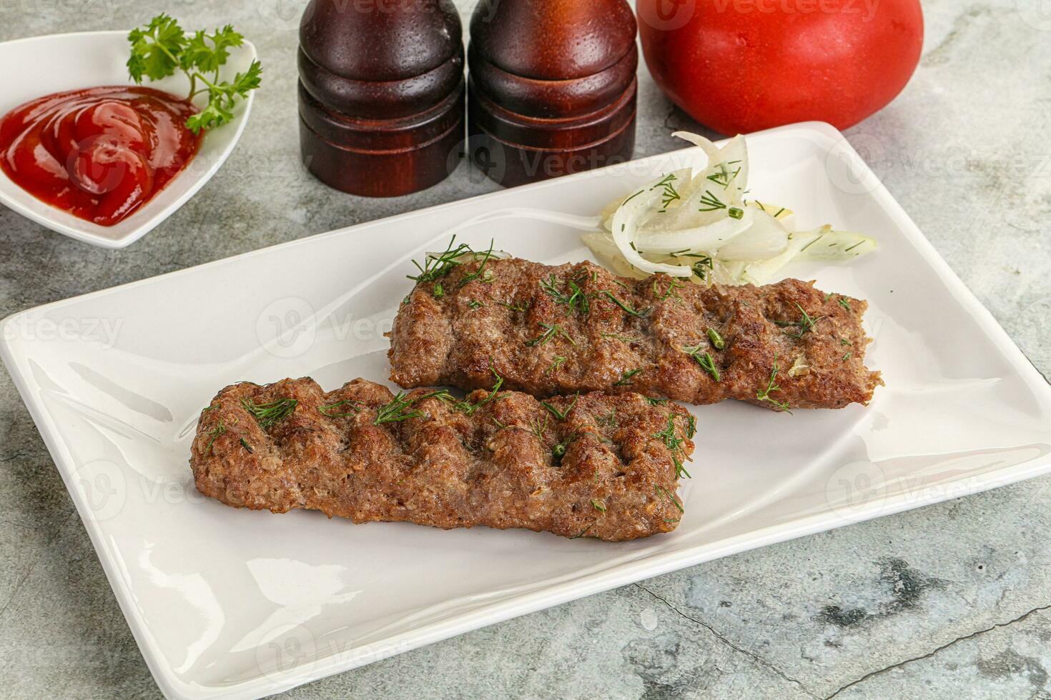 Kebab with beef served onion photo