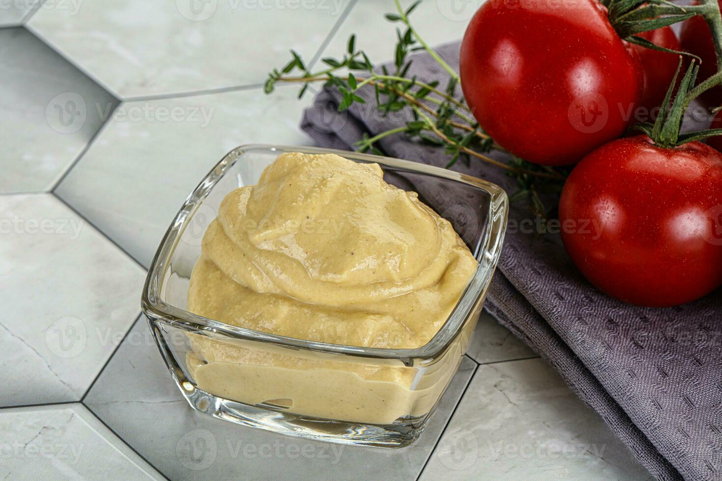 Dijon mustard sauce in the bowl photo