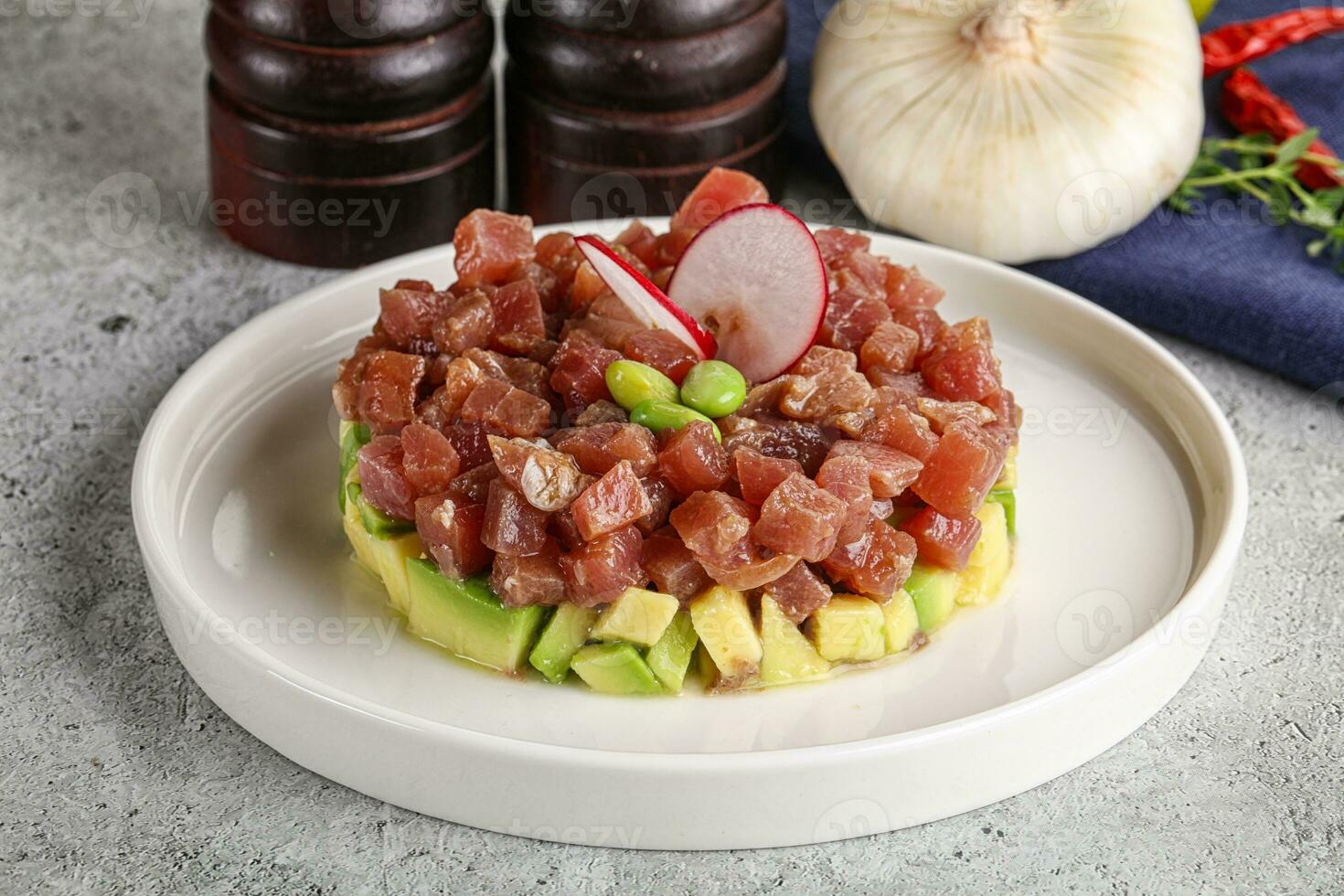 Tuna tartar with avocado and sauce photo