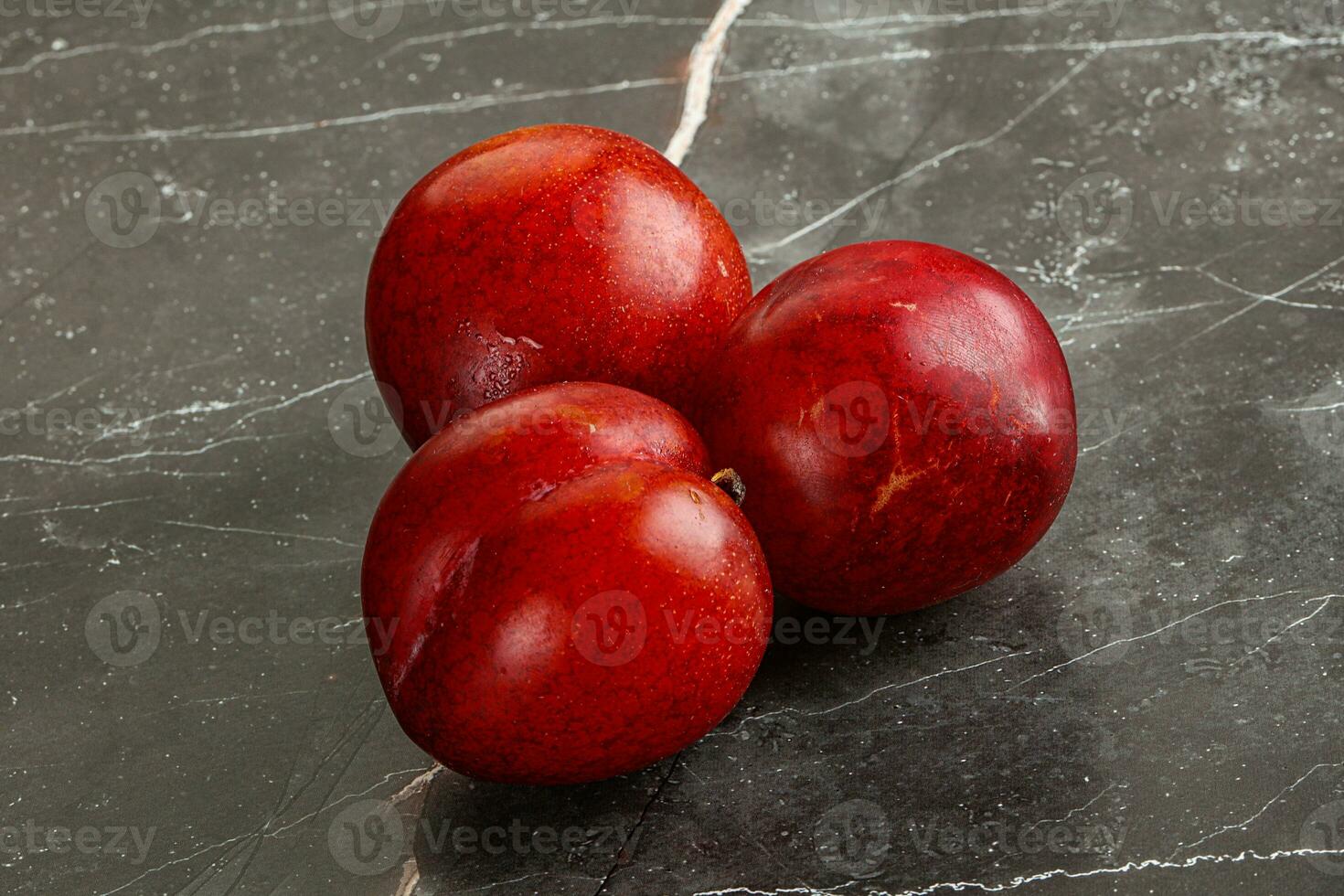 Ripe sweet juicy red plum photo