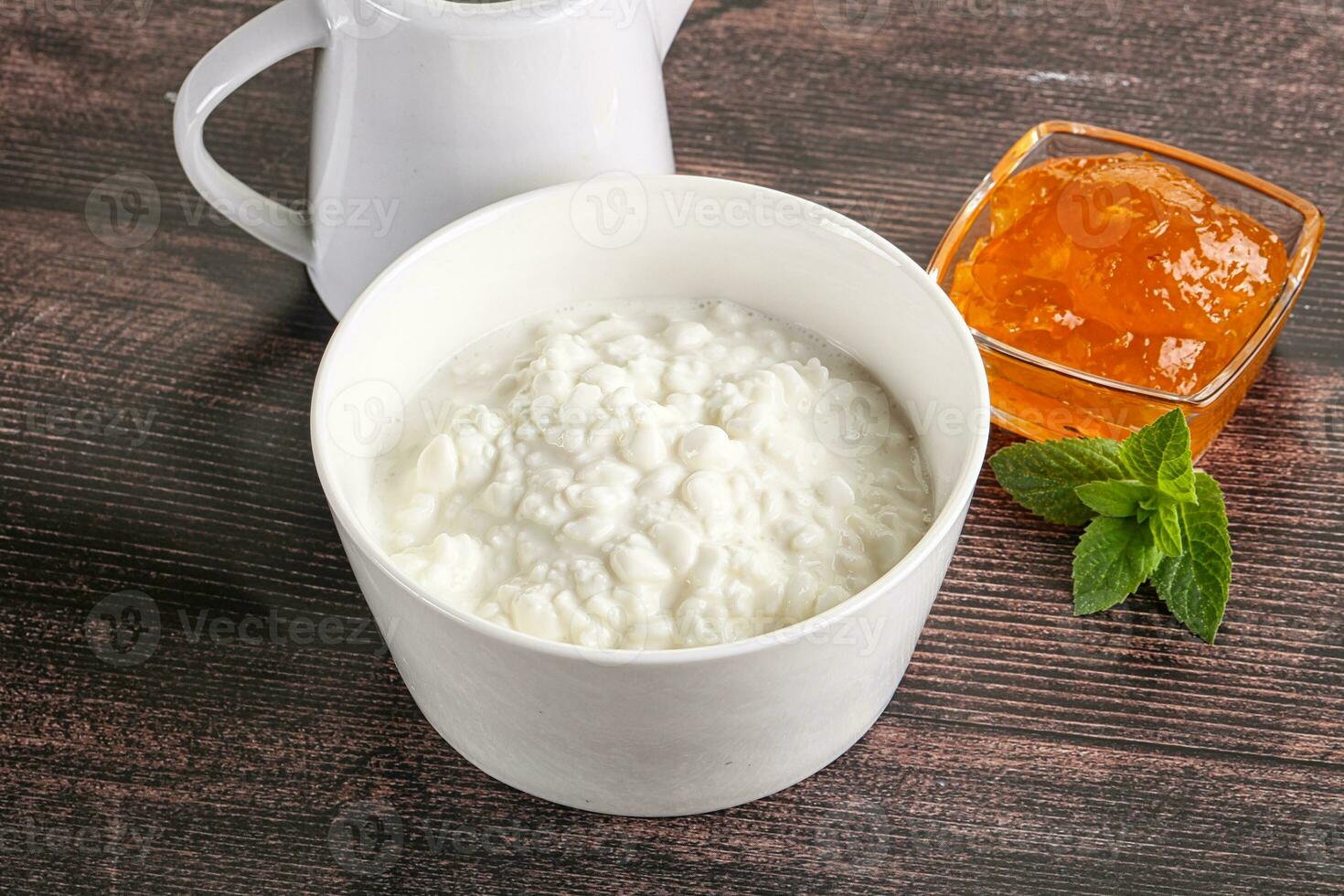 Grain curd with cream and jam photo