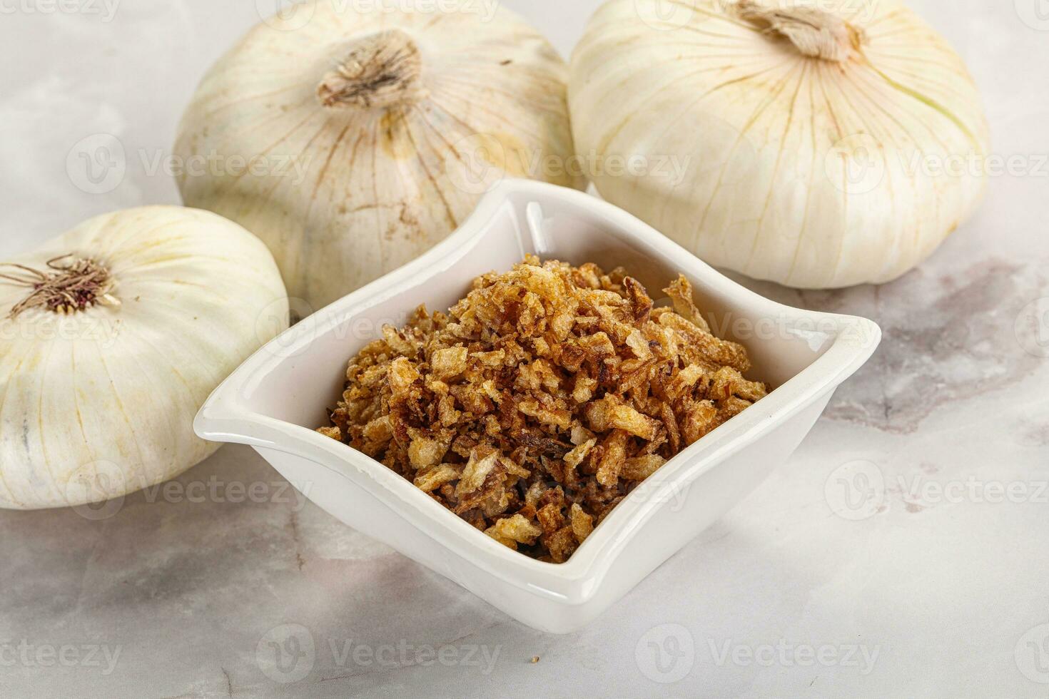 Dried roasted onion flakes for culinary photo