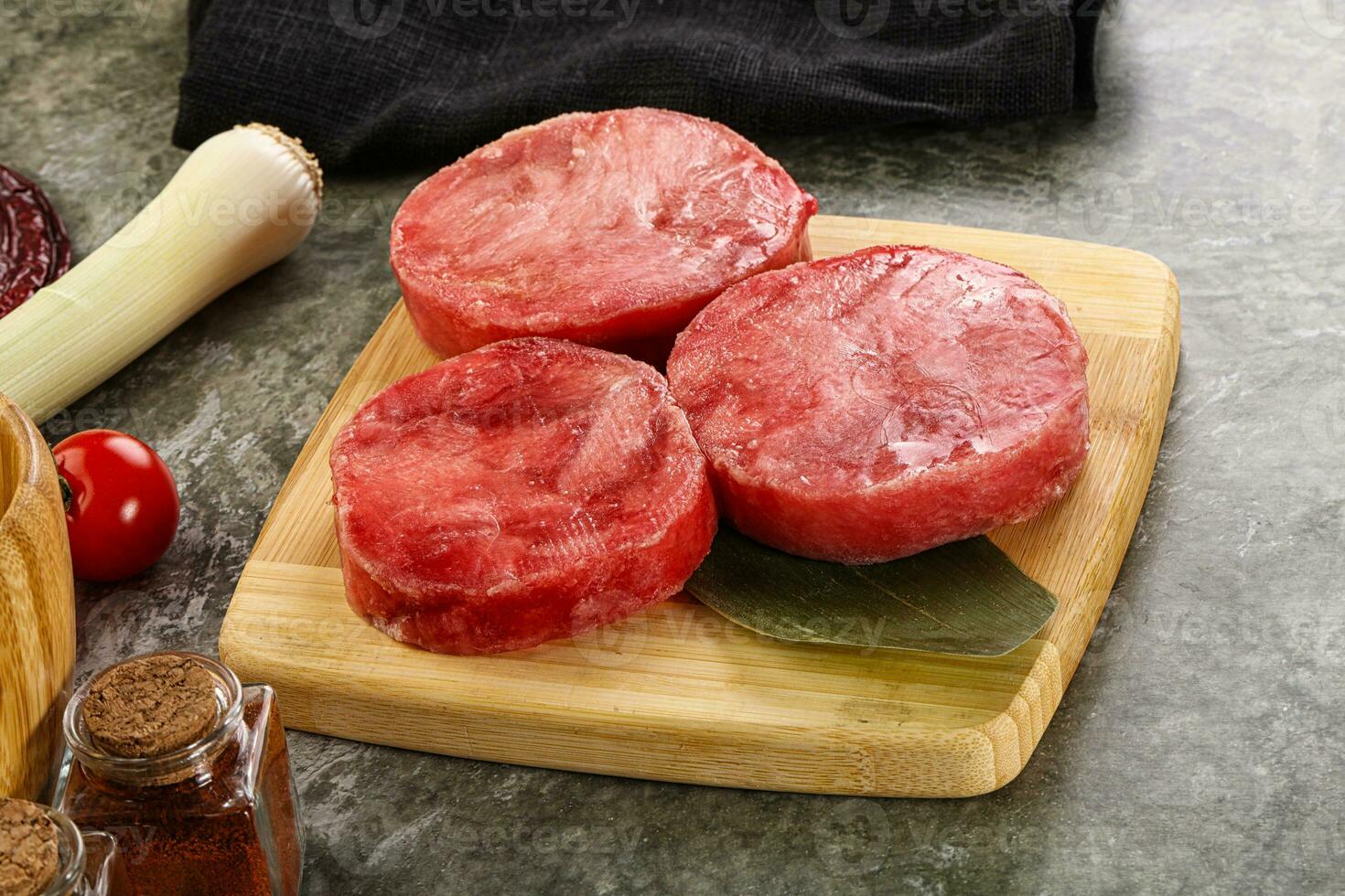 Delicous raw tuna medallion for cooking photo
