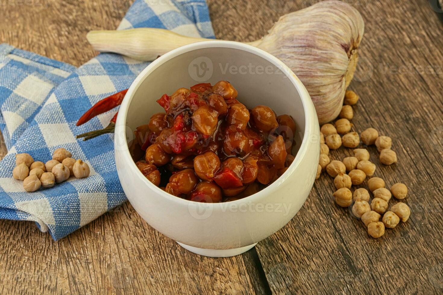 Baked chickpea with tomato sauce photo