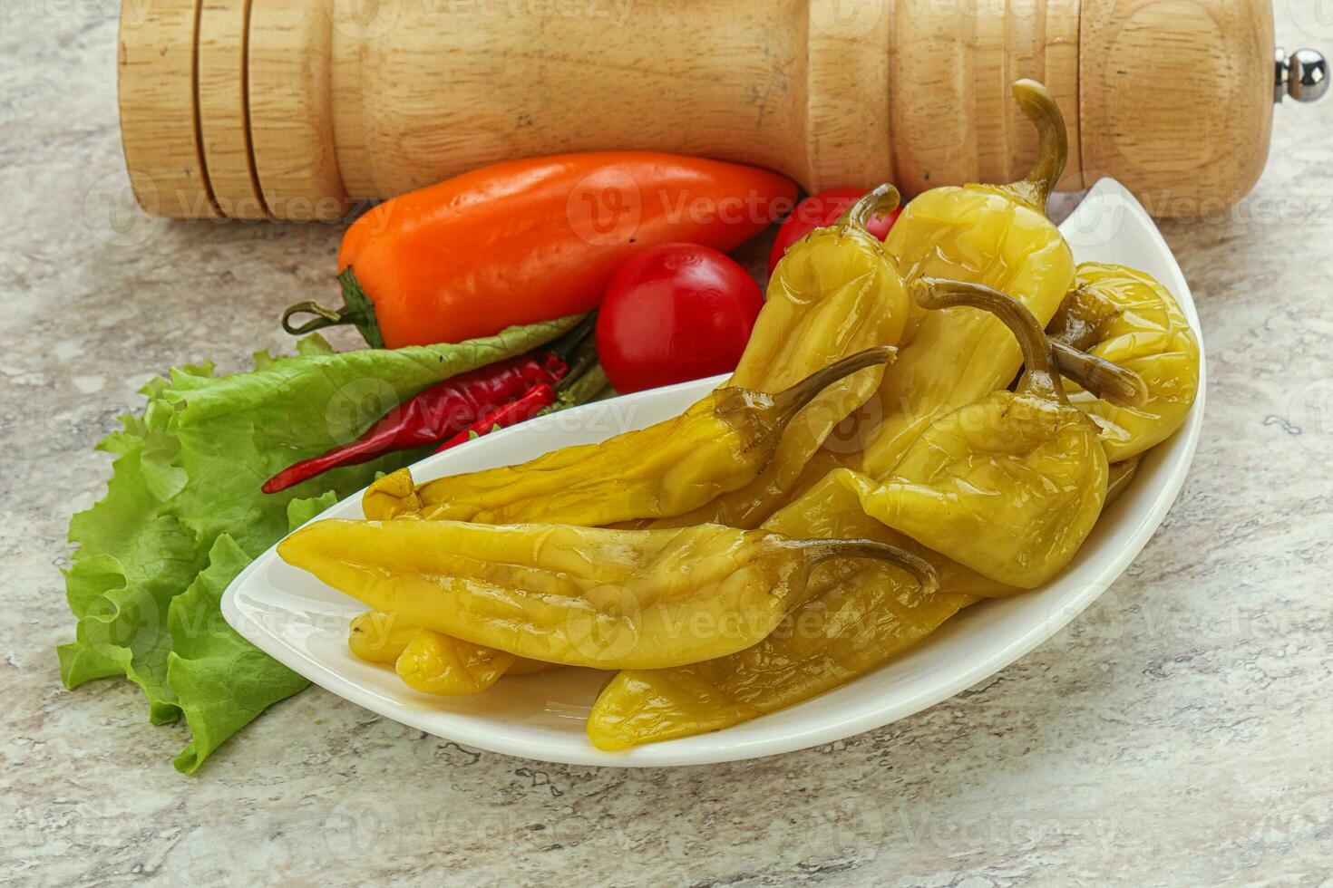 Pickled marinated spicy green pepper photo