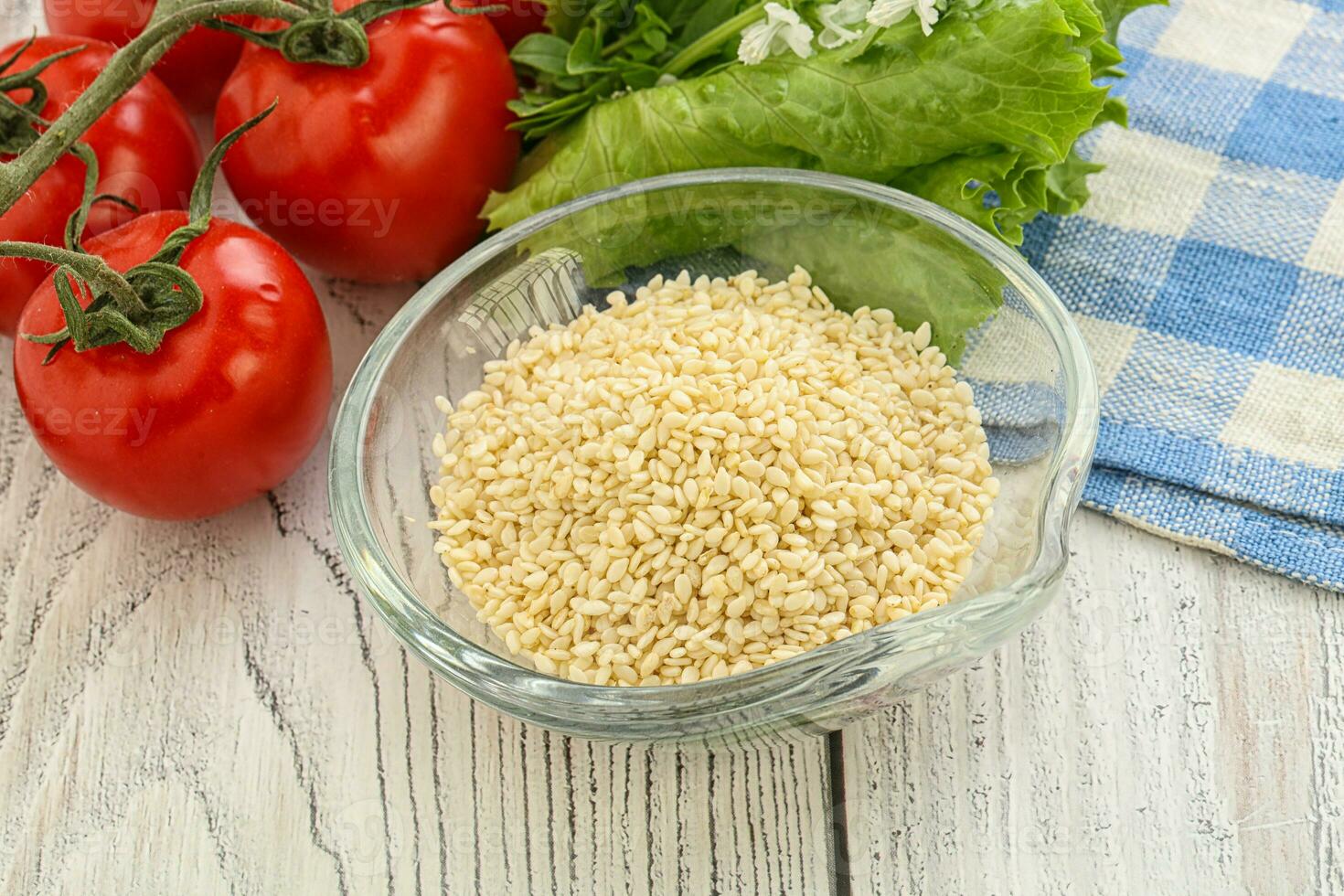 Raw sesame seeds in the bowl photo