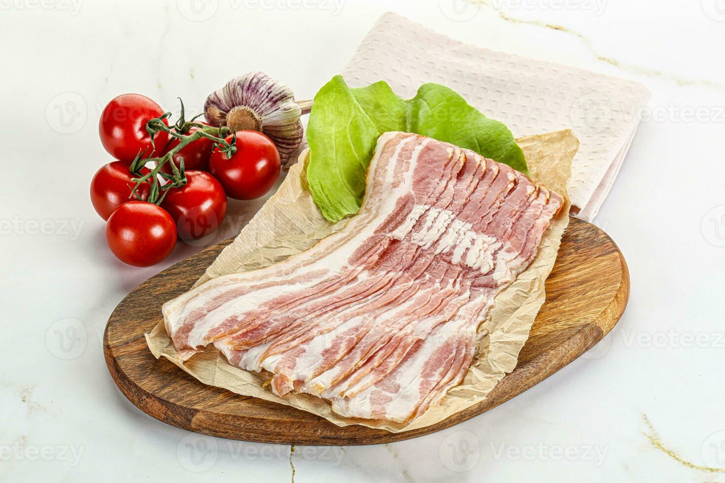 Sliced pork bacon oved board photo