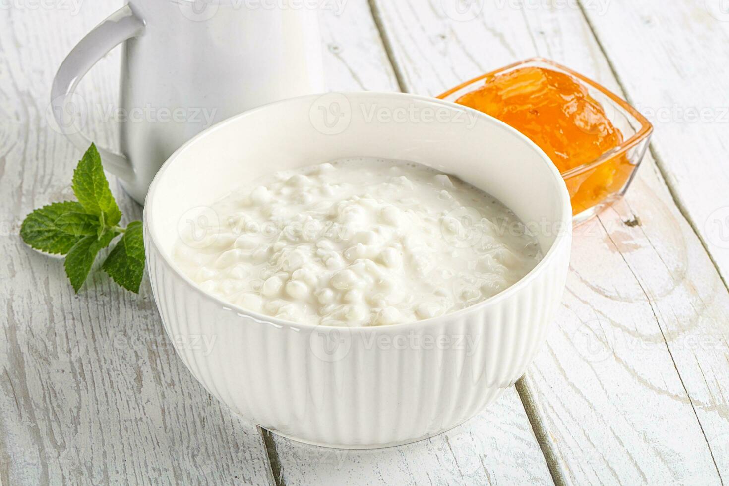 Grain curd with cream and jam photo