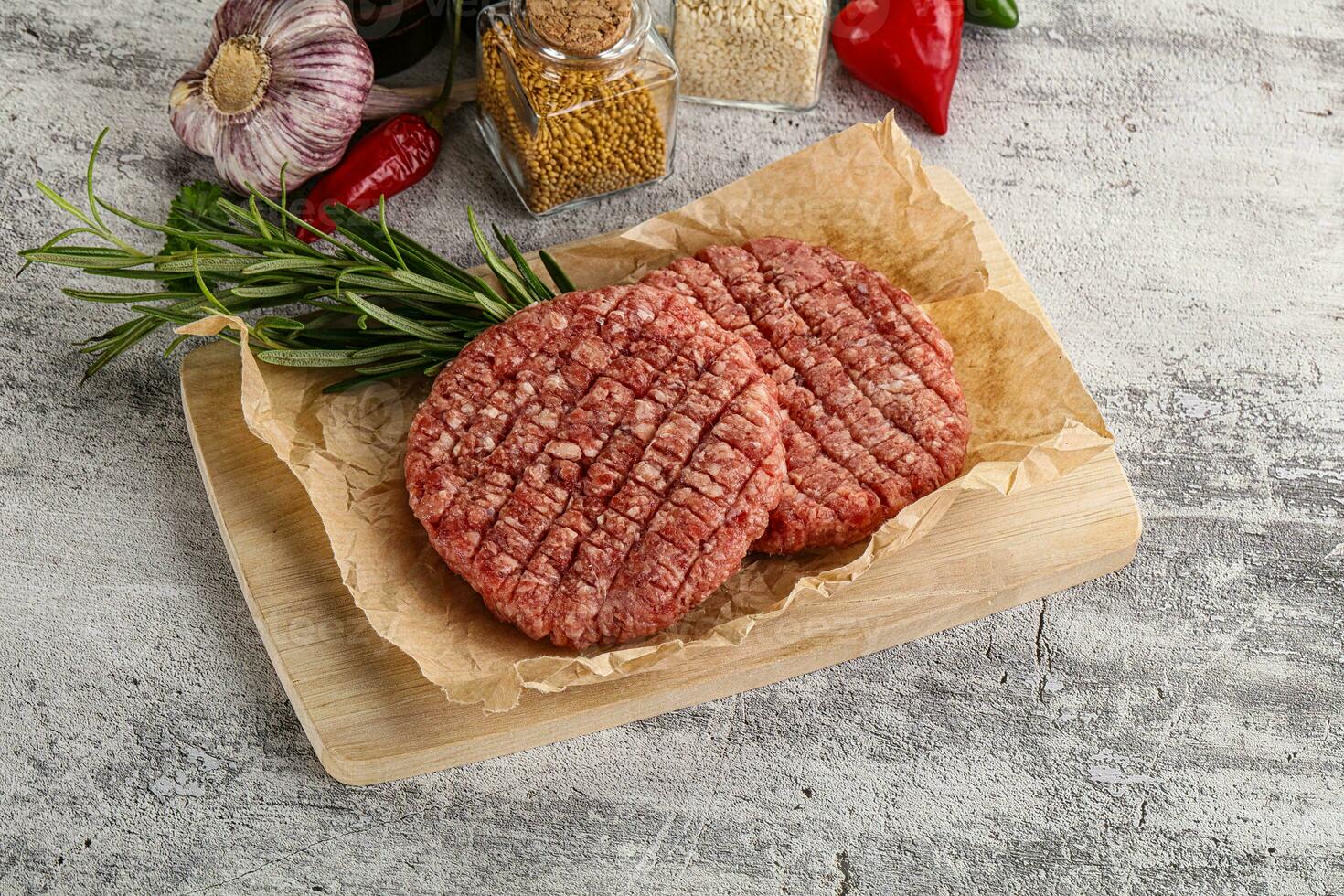 Raw burger cutlet for grill photo