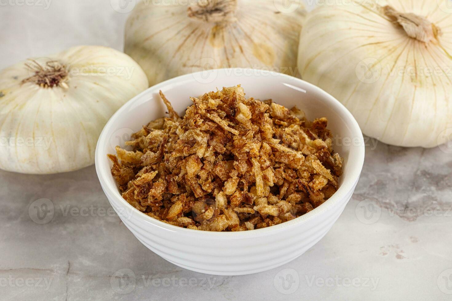 Dried roasted onion flakes for culinary photo