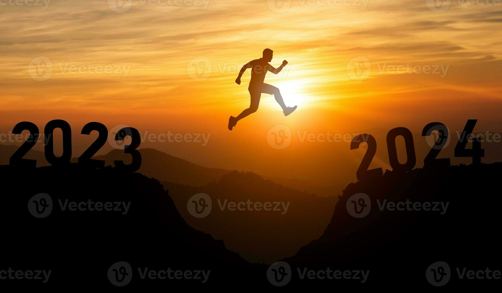 Silhouette man jump happy new year 2024 concept, man jumping over barrier cliff and success from 2023 cliff to 2024 cliff with sunset background. Happy New Year for web banner and advertisement. photo