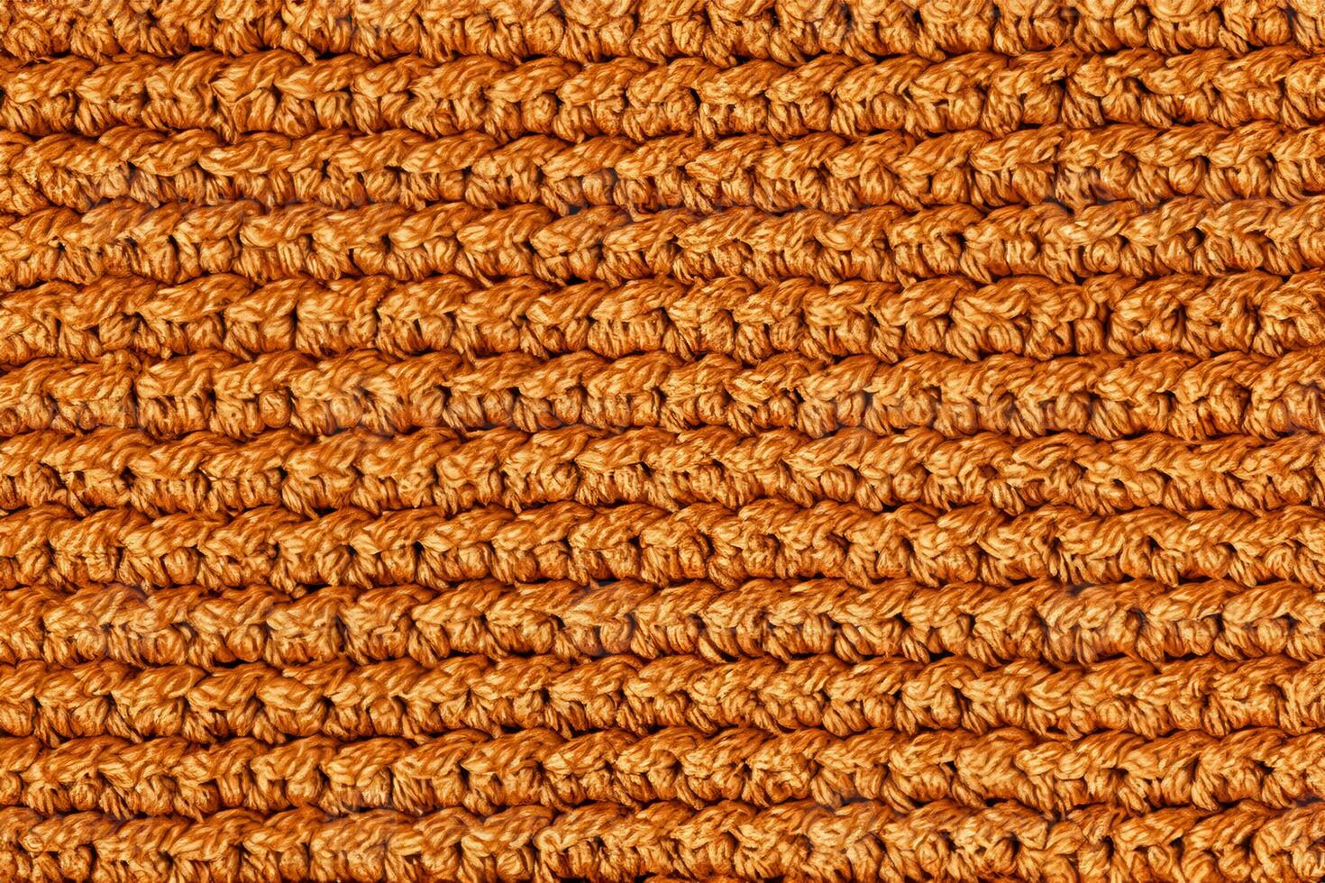 Orange knitted fabric texture background. Top view. Copy, empty space for text photo