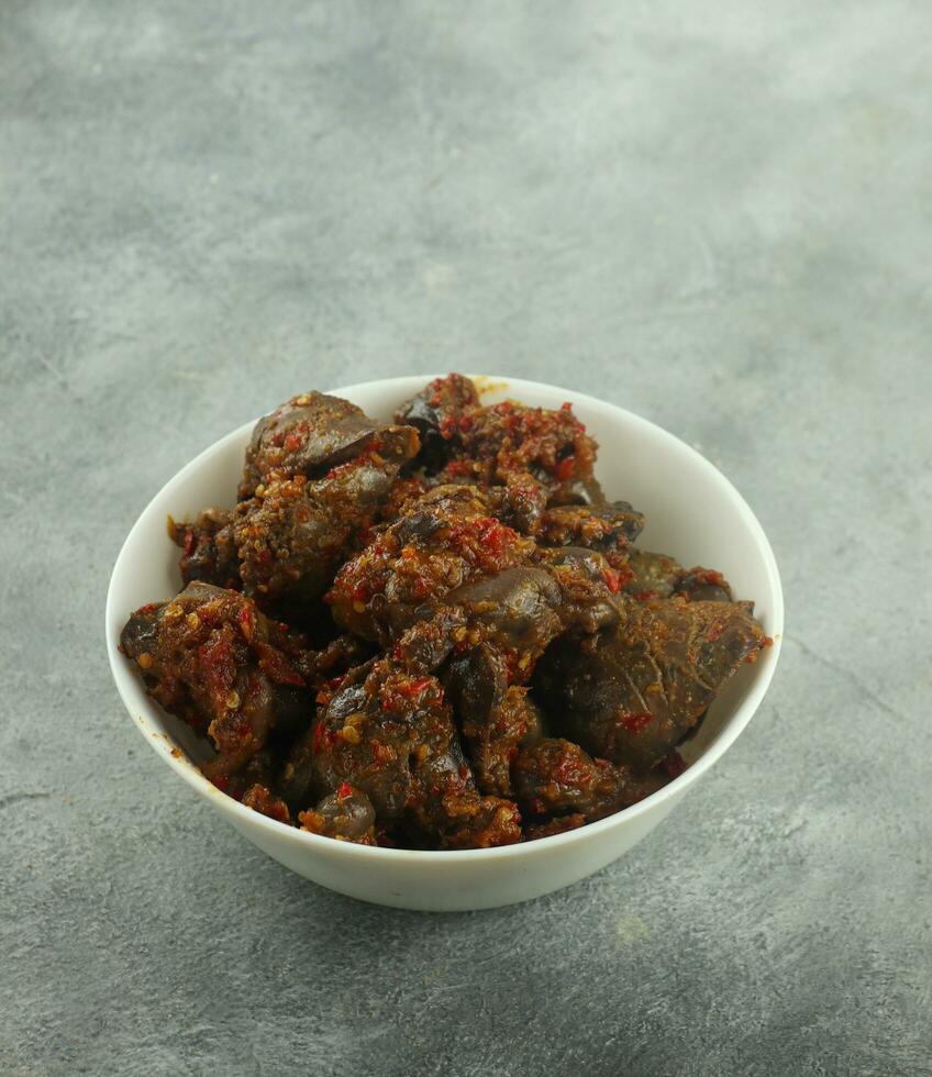 spicy chili chicken liver, and spinach, tempeh and sour vegetables, selective focus photo