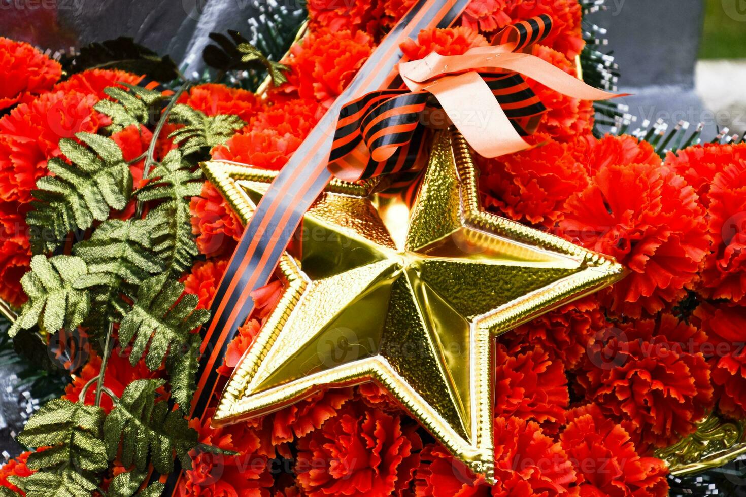 Wreath with a star on the monument. Victory Day. Symbols of the day of victory over fascist Germany. photo