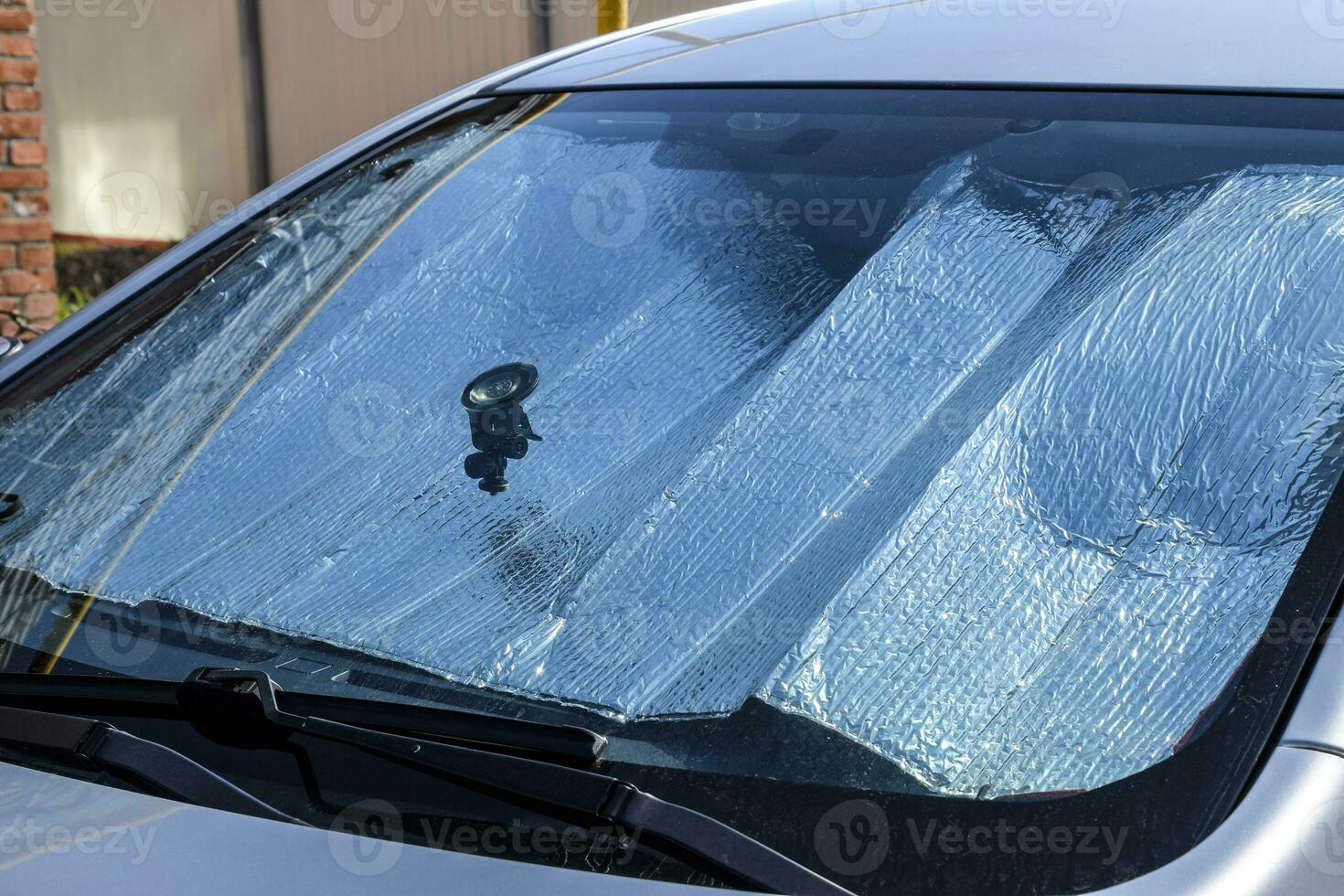 Protection of the car panel from direct sunlight. Sun Reflector windscreen photo
