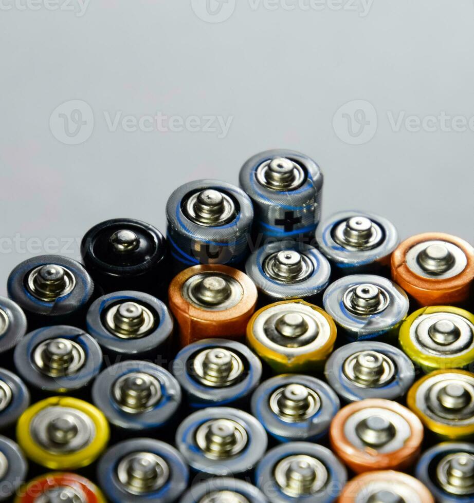 Salt and alkaline batteries, source of energy for portable technology. AAA and AA batteries photo