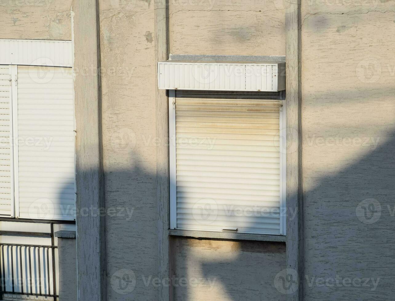 External blinds on the windows for protection from the sun's rays. photo