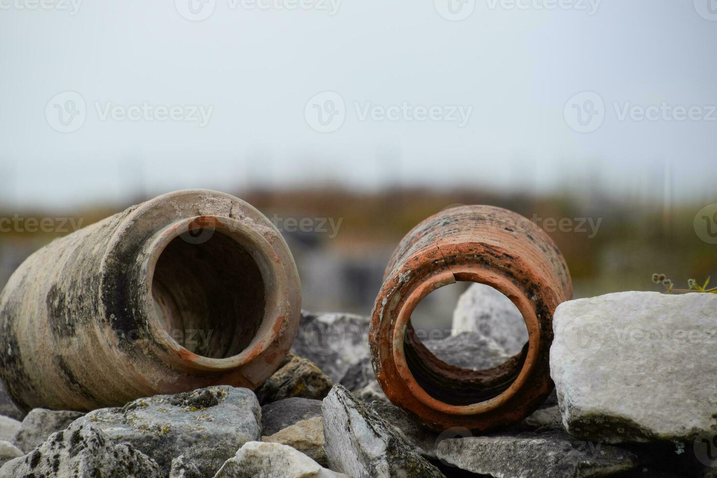 remains of ancient ceramic pipes from the water supply. Prefabricated sections of ceramics from which the pipeline was assembled. photo