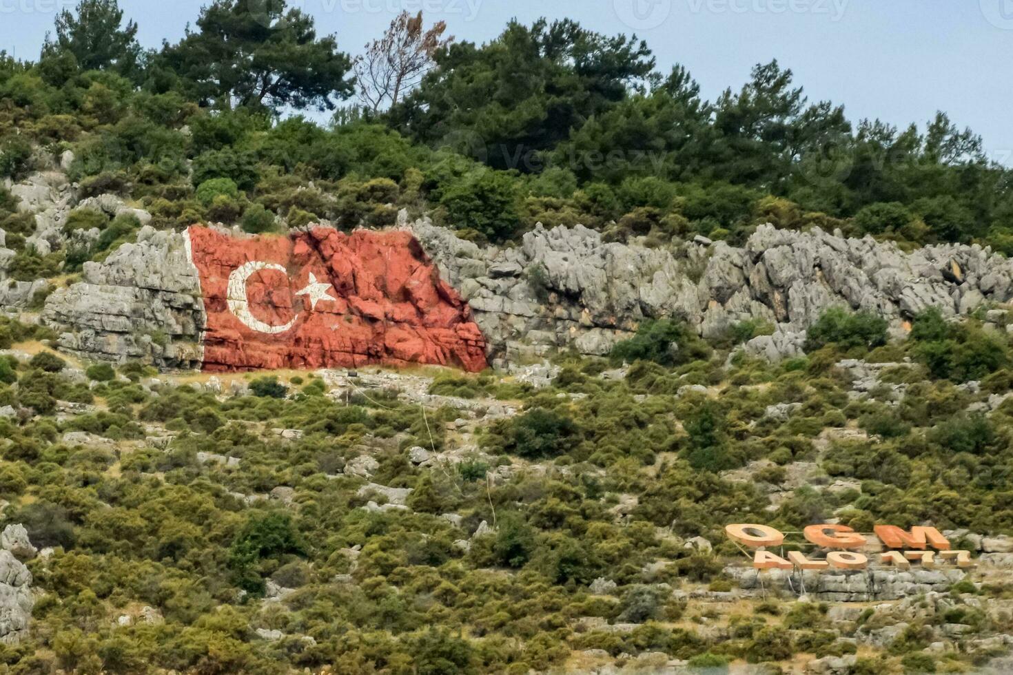 Flag of Turkey drawn on the rocks. Cliff with the flag of Turkey. photo