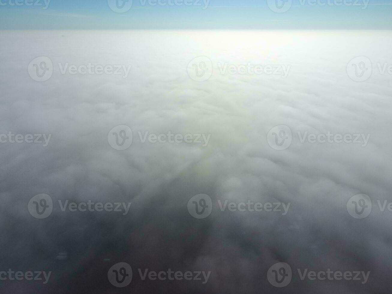 In the skies above the fog. Sunrise over the fog. Clouds near the ground photo