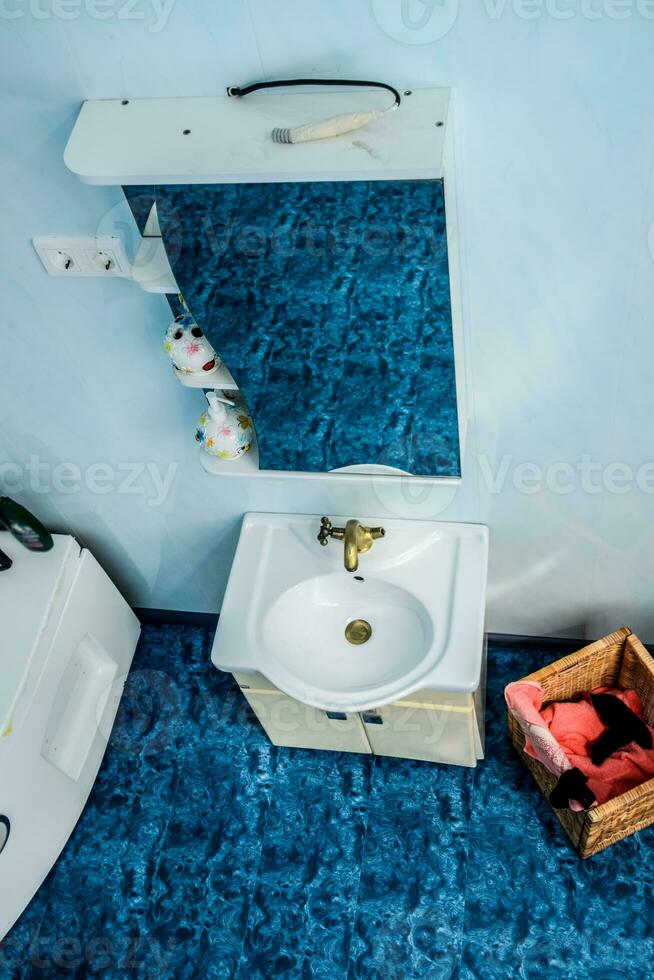 Top view bathroom, mirror and washbasin. photo