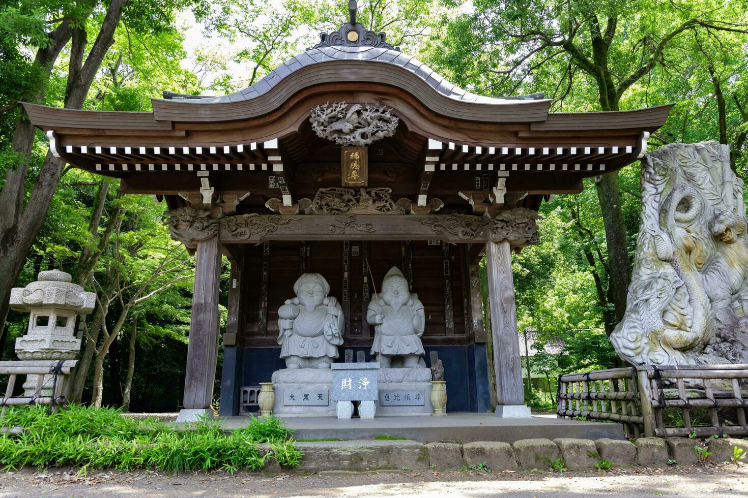 Japanese guardian statues at the traditional street in Tokyo photo