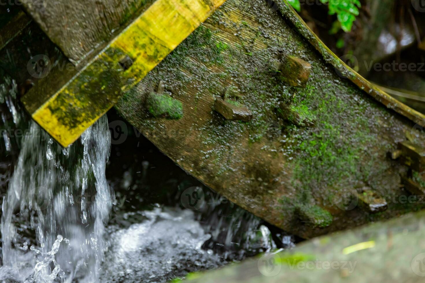 A historic wooden wheel on the water surface in Tokyo close up photo