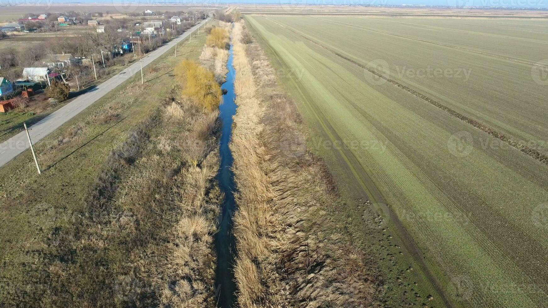 The channel of the lower level of the irrigation system of fields. Infrastructure for the cultivation of rice photo