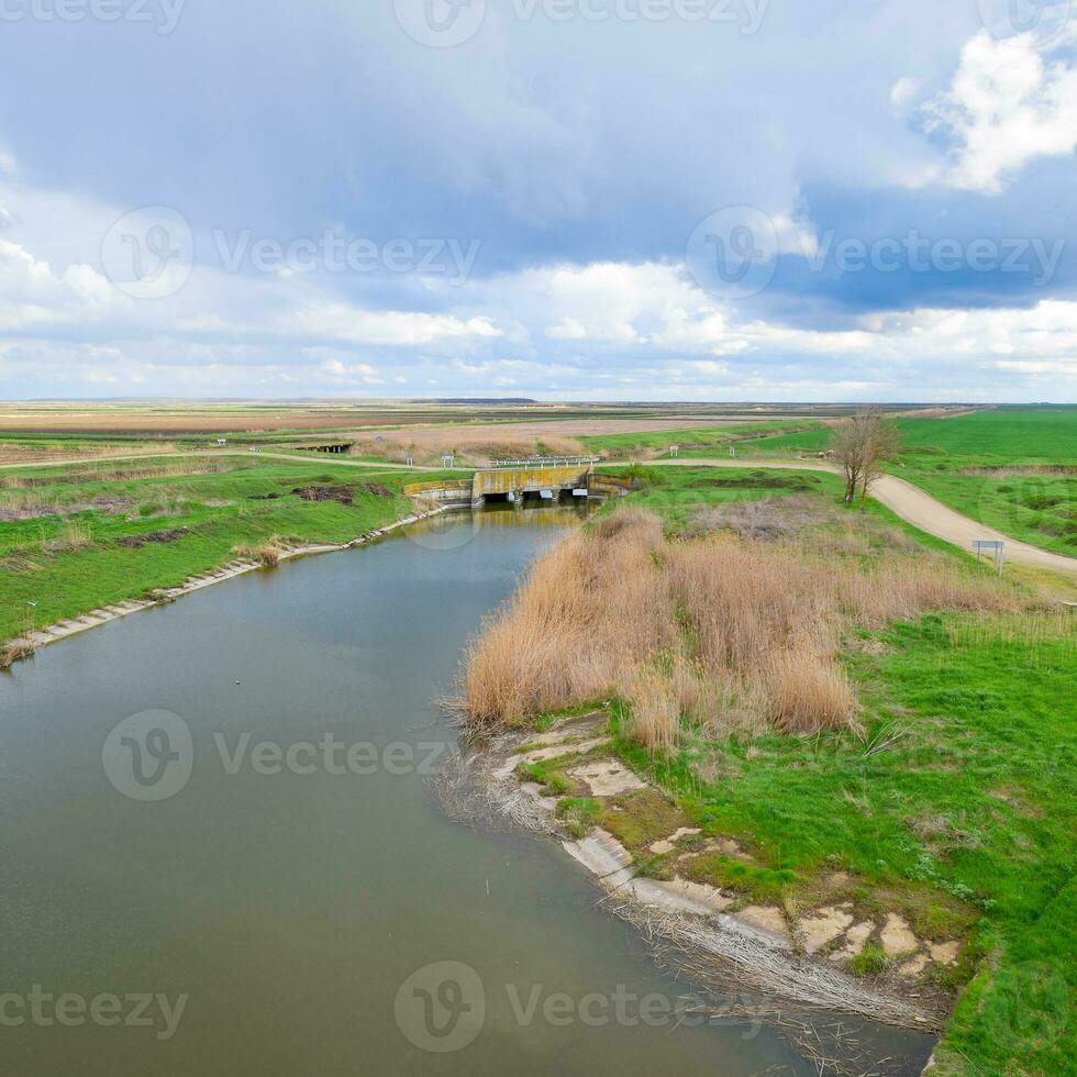 Bridges through irrigation canals. Rice field irrigation system photo