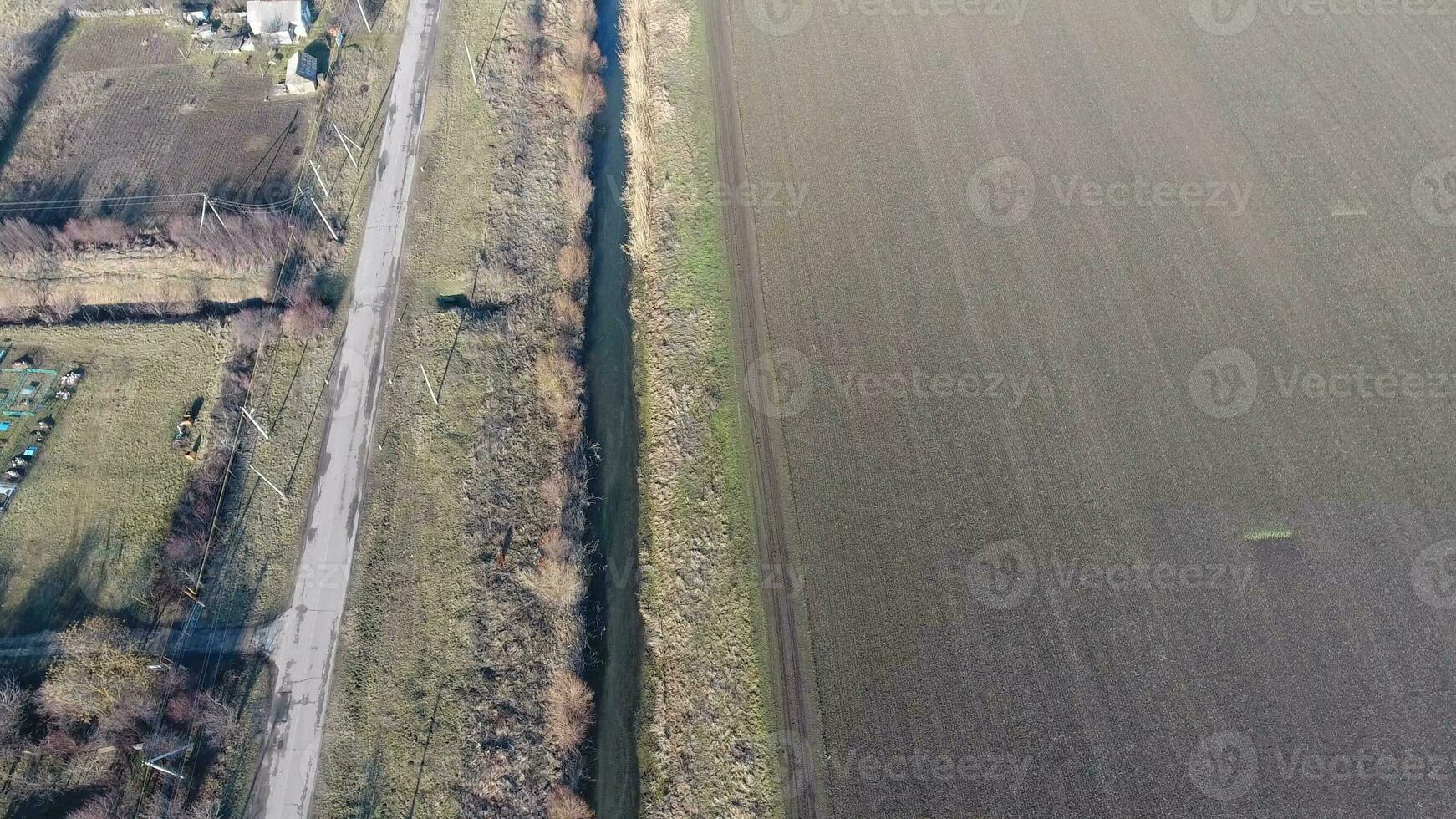 The channel of the lower level of the irrigation system of fields. Infrastructure for the cultivation of rice photo