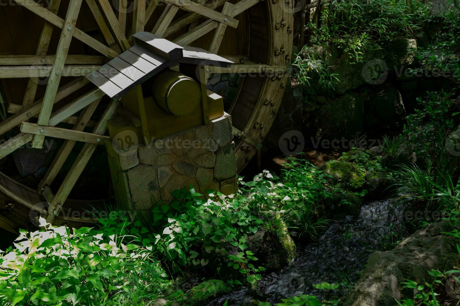 A historic wooden wheel on the water surface in Tokyo photo