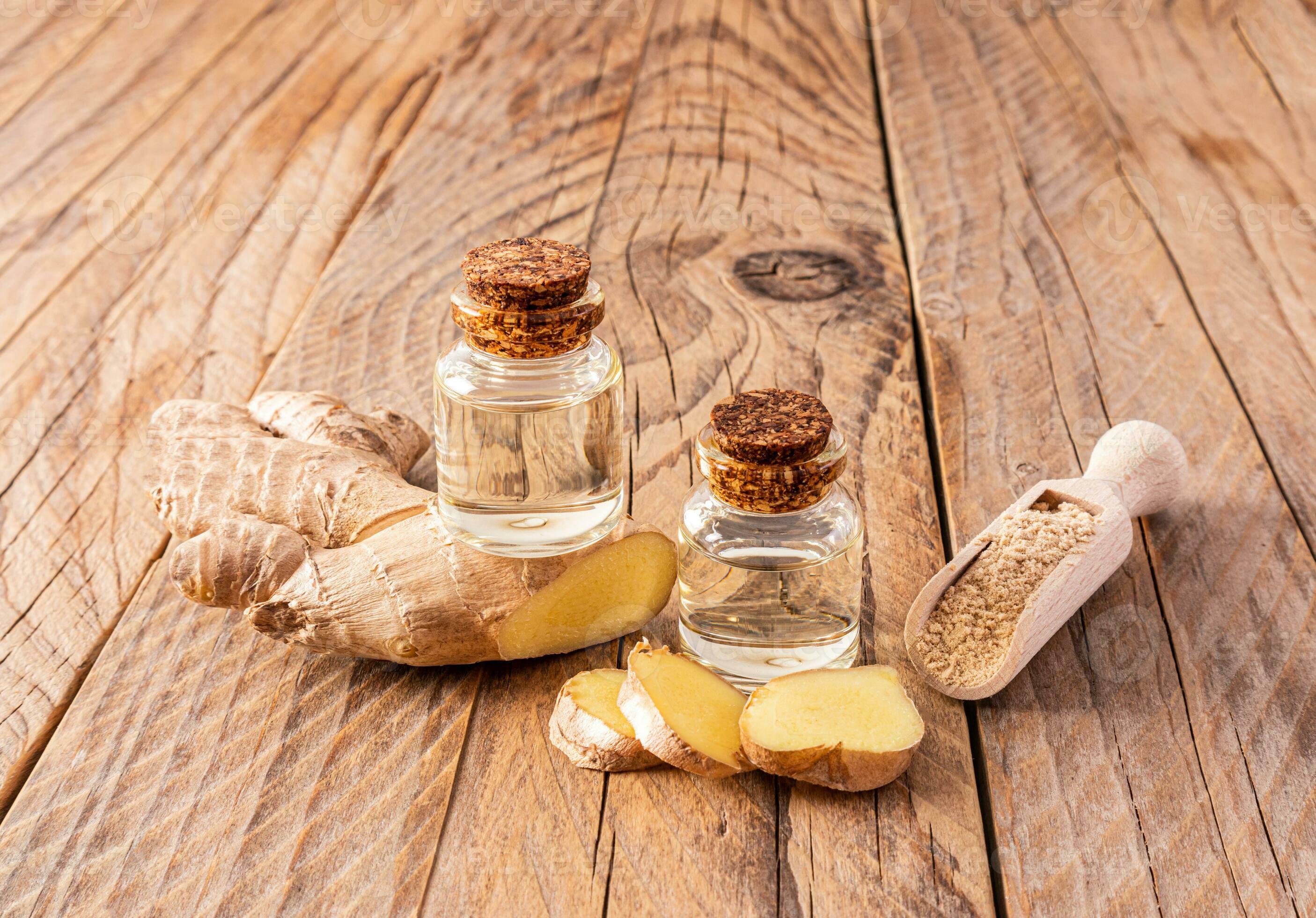 Homemade natural ginger root oil in two bottles with a cork cap on a