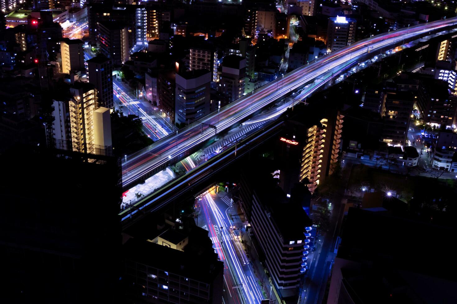 A night cityscape at the highway in Osaka telephoto shot photo