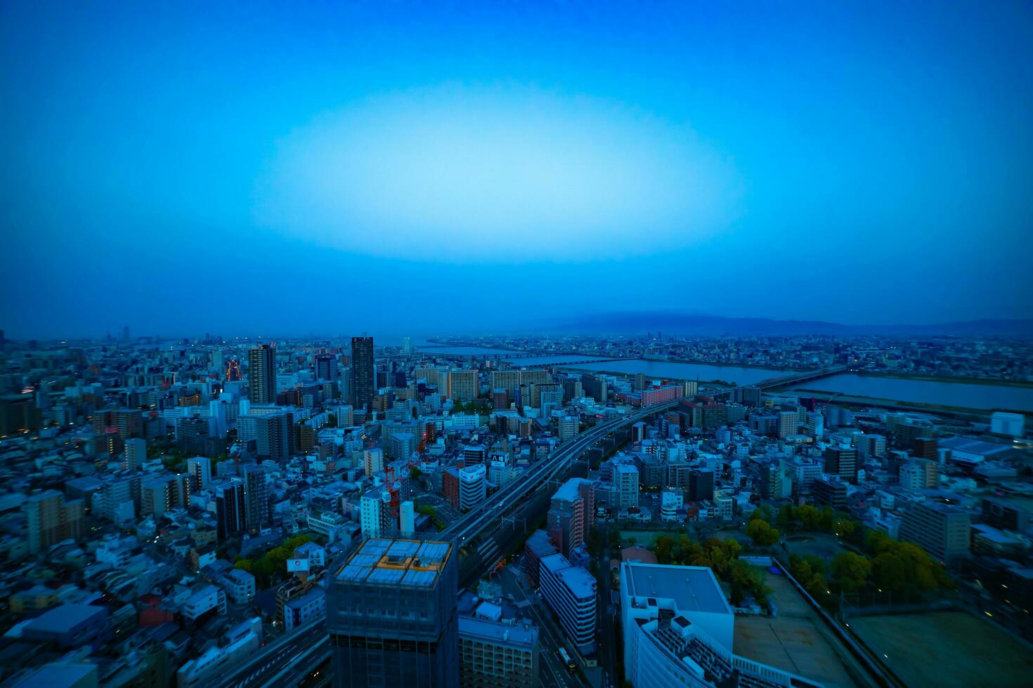 A panoramic cityscape near Yodo river in Osaka wide shot photo