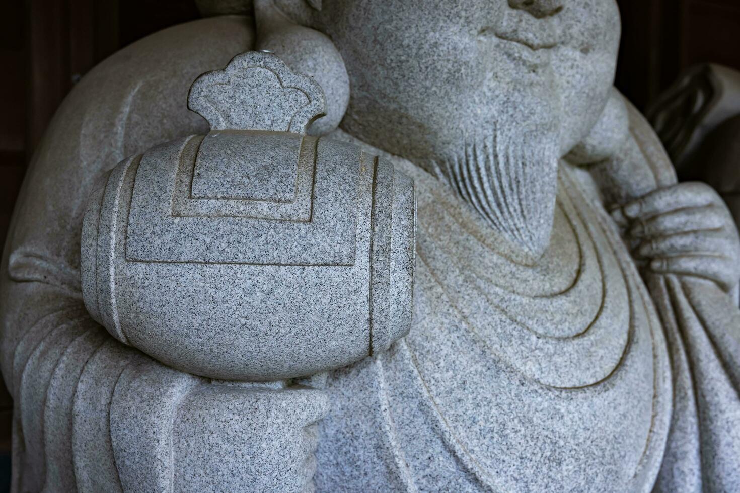 A Japanese guardian statue at the traditional street in Tokyo closeup photo