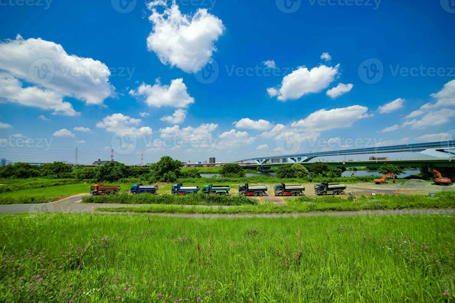 A traffic jam at the urban street near the river wide shot photo