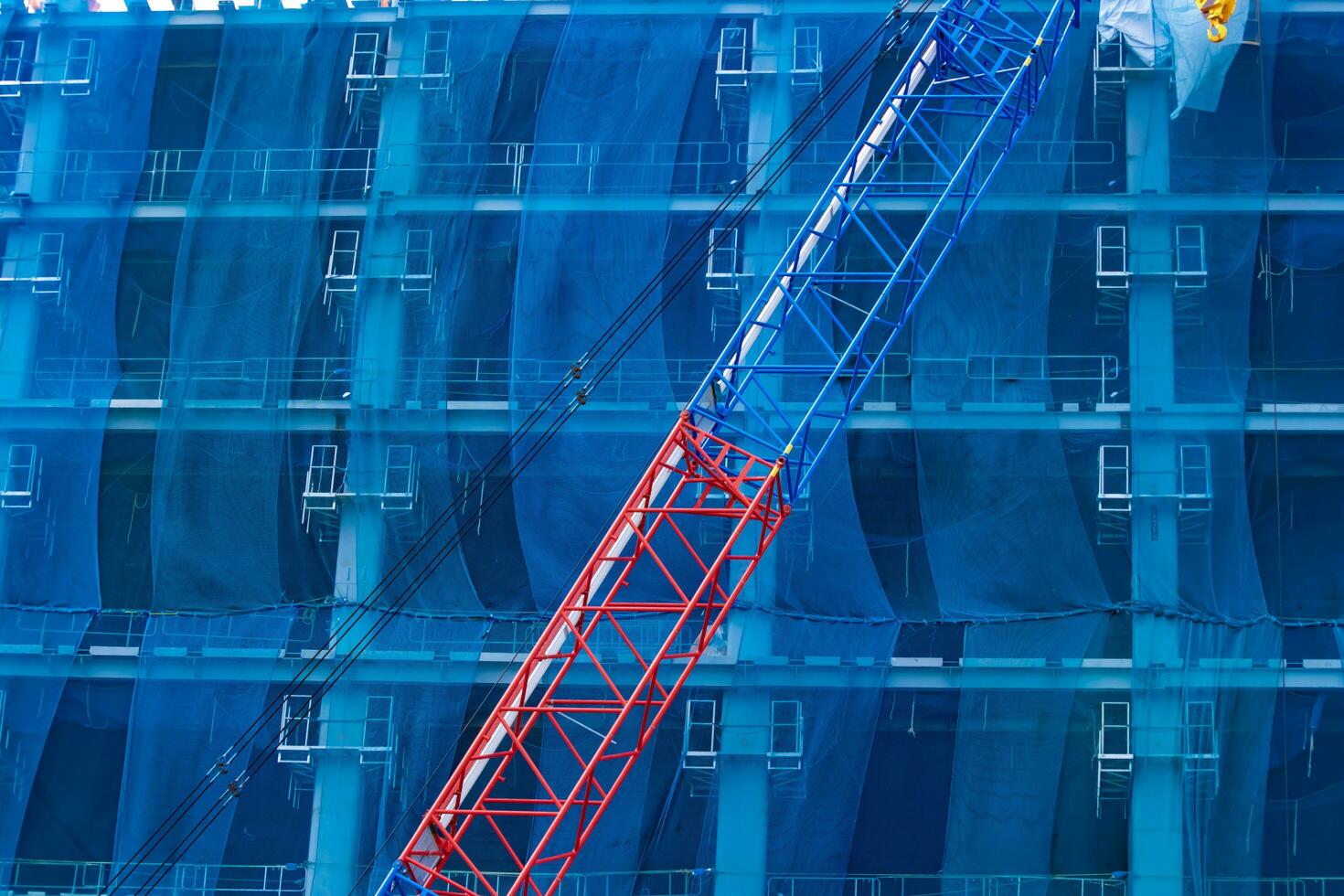 Crane at the under construction in Tokyo telephoto shot photo