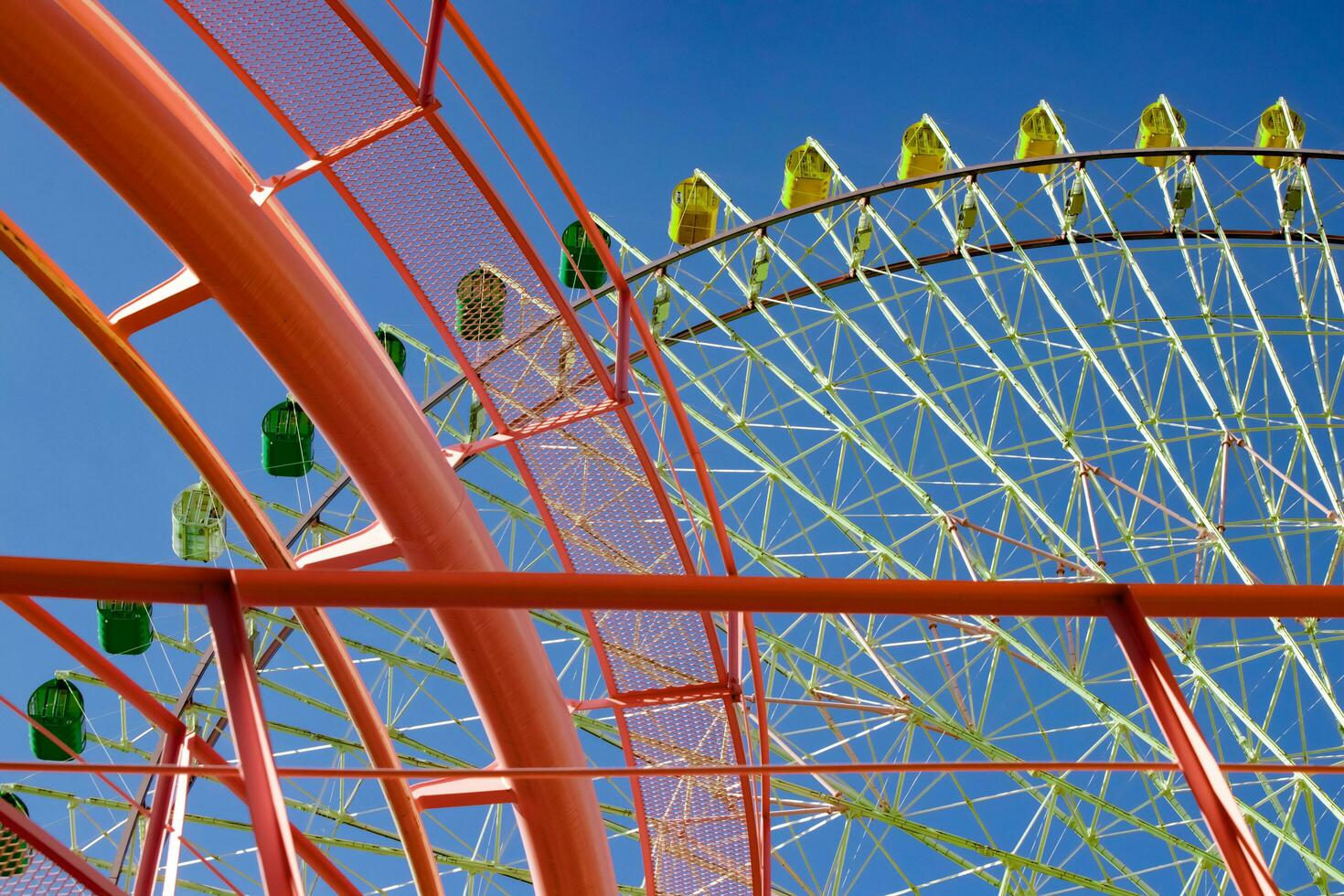 A ferris wheel near the urban city in Yokohama telephoto shot photo