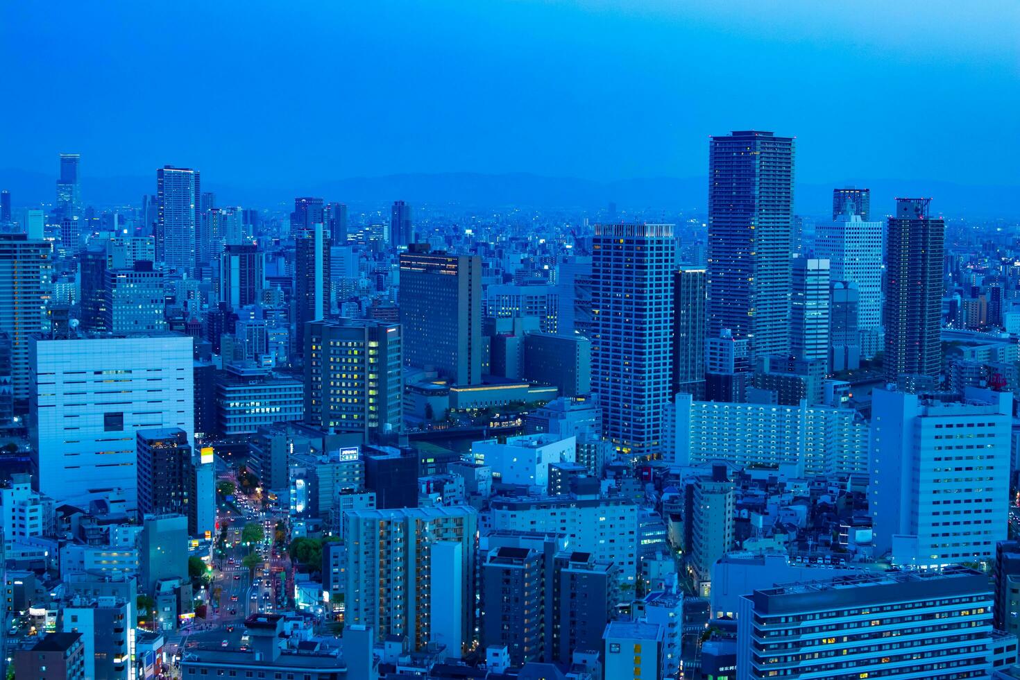 A dusk cityscape by high angle view near the office buildings in Osaka photo