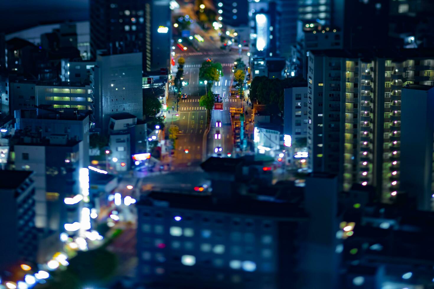 A night miniature cityscape by high angle view at the urban street in Osaka photo