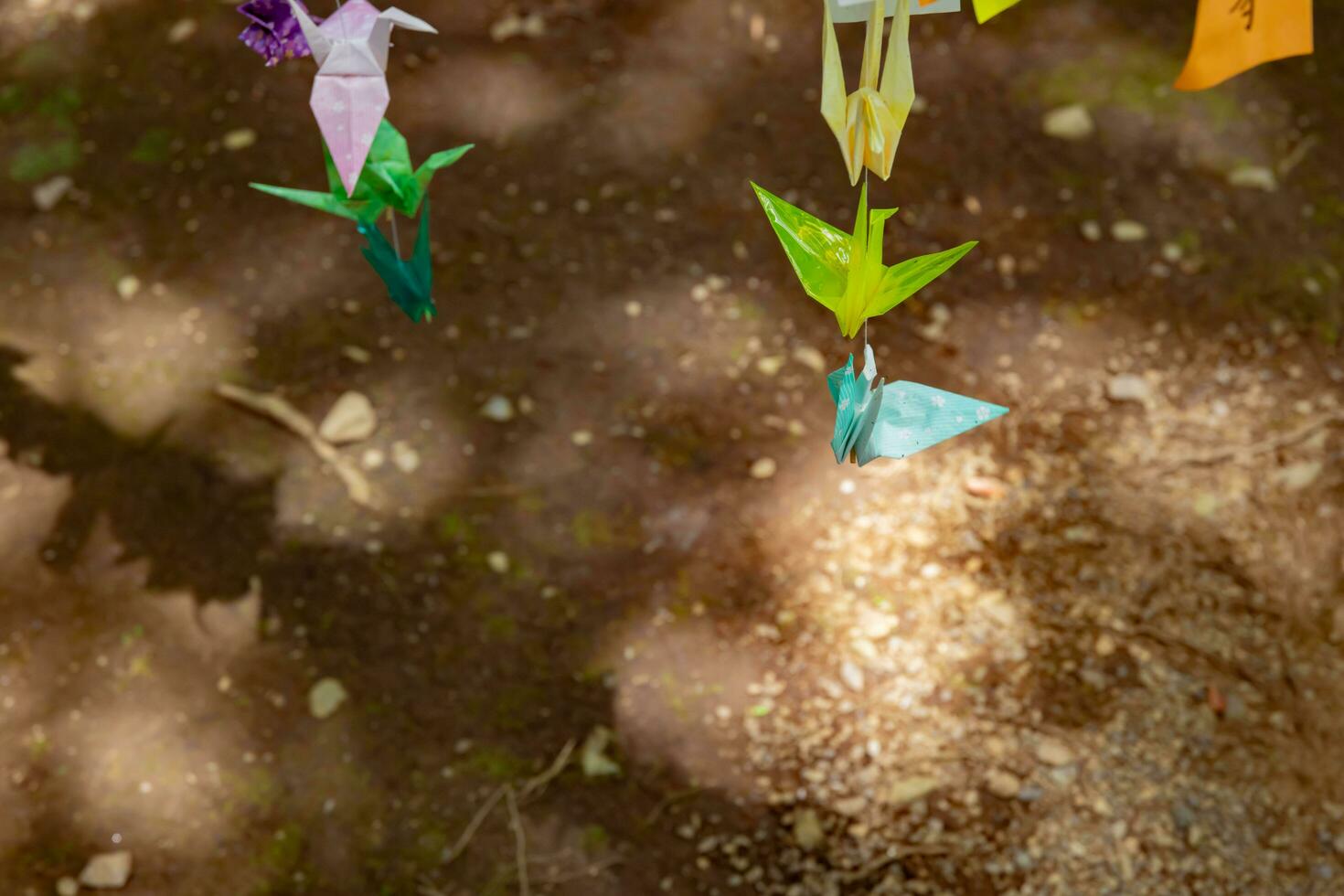 A paper crane swaying in the wind at the traditional street photo