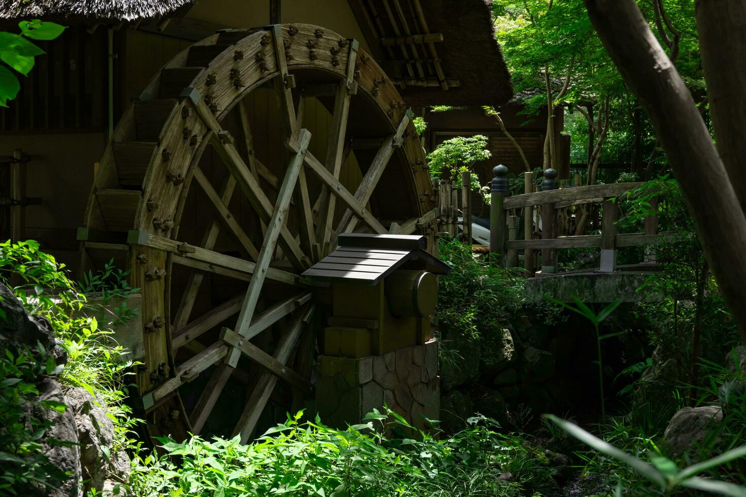 A historic wooden wheel on the water surface in Tokyo photo