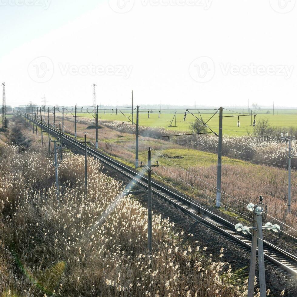 Plot railway. Top view on the rails. High-voltage power lines for electric trains photo