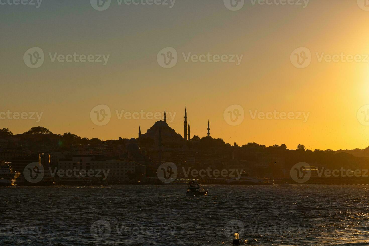 Istanbul photo. Silhouette of Suleymaniye Mosque at sunset. photo